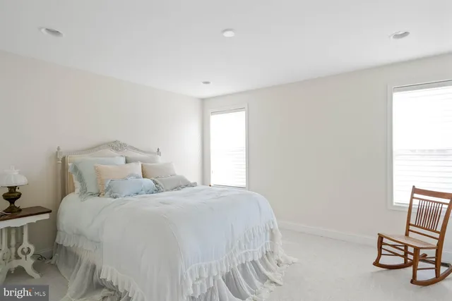 a front view of a house with a garden and plants