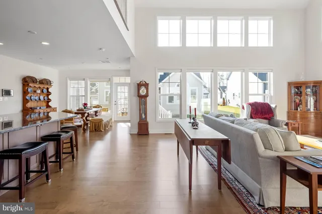 a living room with furniture a fireplace and a table