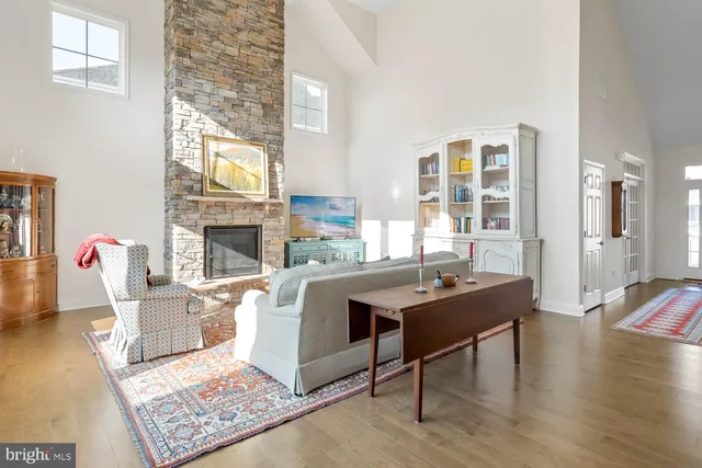 a kitchen with granite countertop a sink a stove and cabinets