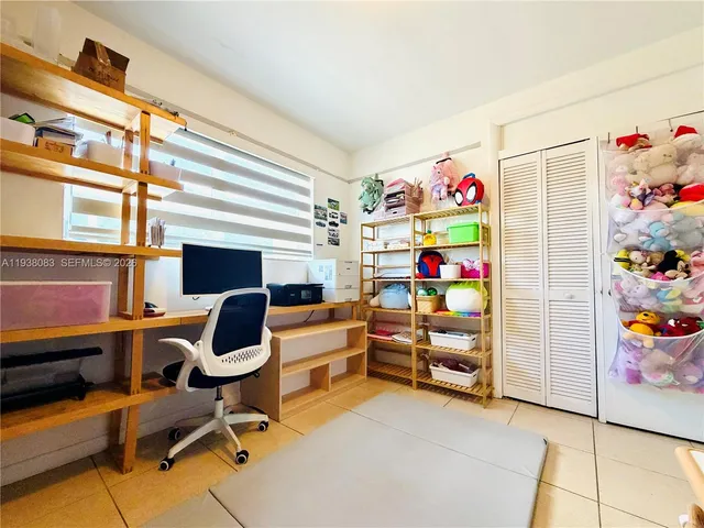 a room with furniture and a workspace