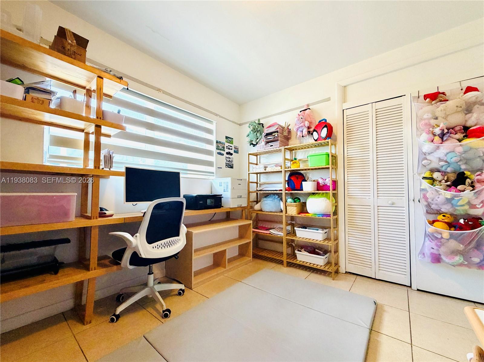 546 East 39th Street Hialeah, FL 33013 - Photo 14 of 24 a room with furniture and a workspace