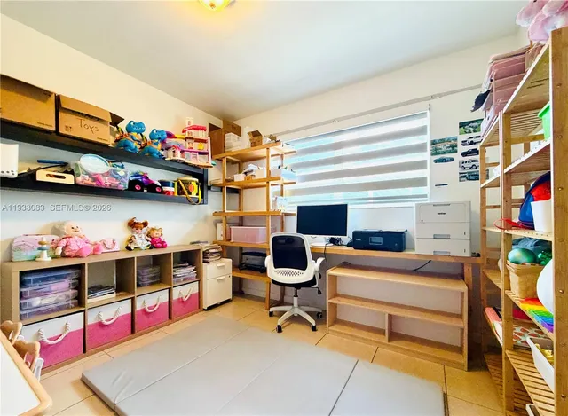 a view of a workspace with furniture