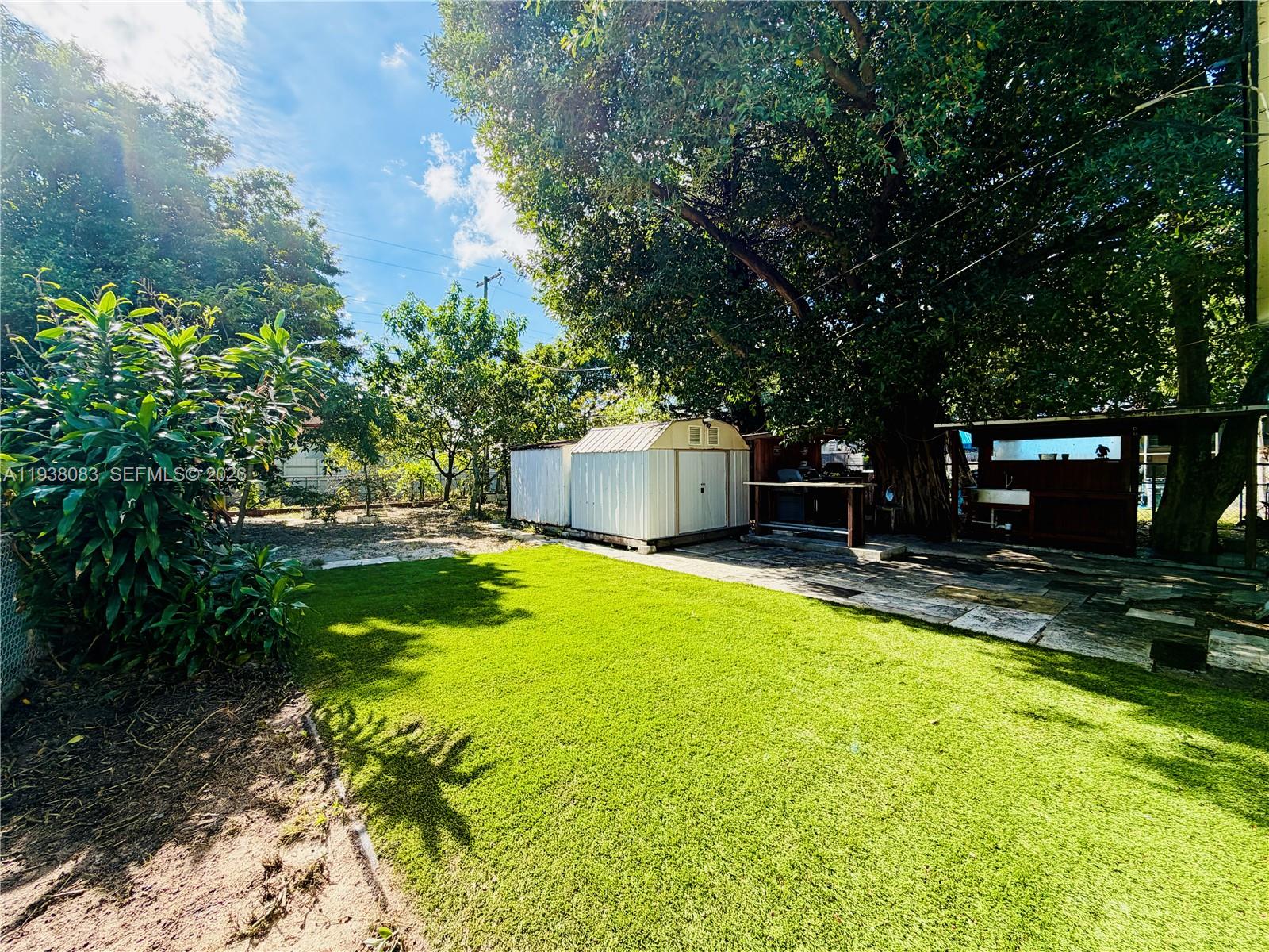 546 East 39th Street Hialeah, FL 33013 - Photo 19 of 24 a swimming pool with outdoor seating and yard