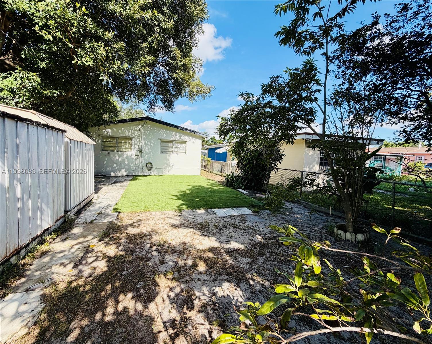546 East 39th Street Hialeah, FL 33013 - Photo 20 of 24 a view of a yard with plants and large trees