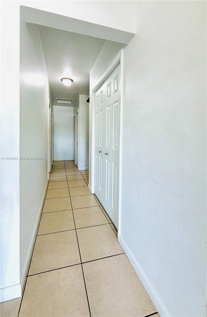 546 East 39th Street Hialeah, FL 33013 - Photo 8 of 24 a bathroom with a mirror and a shower