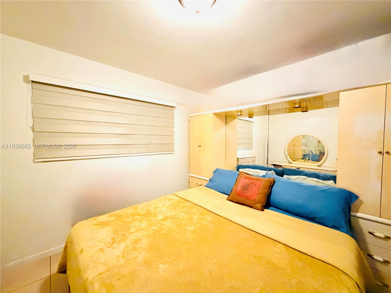 546 East 39th Street Hialeah, FL 33013 - Photo 10 of 24 a bedroom with a bed and window