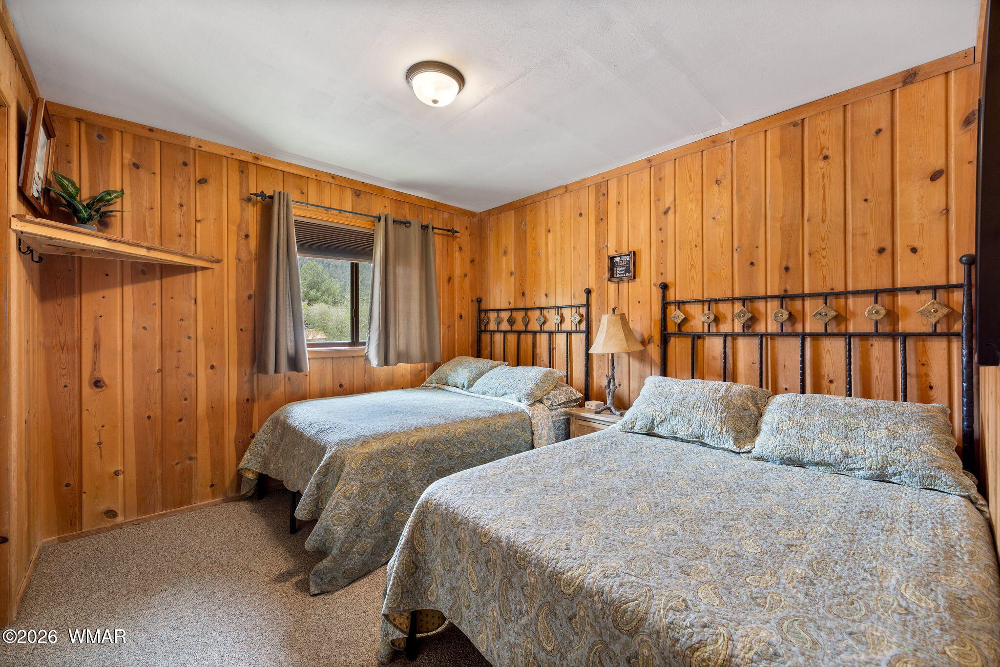 85 Main Street Greer, AZ 85927 - Photo 18 of 55 a bedroom with two beds and painted walls
