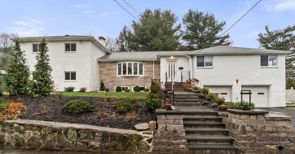 a front view of a house with a yard