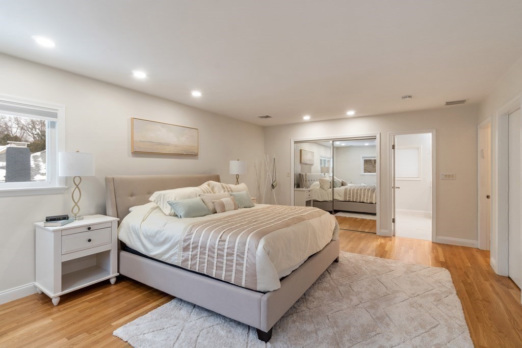 51 Donna Road Newton, MA 02459 - Photo 11 of 30 a bedroom with a large bed and a view of bathroom
