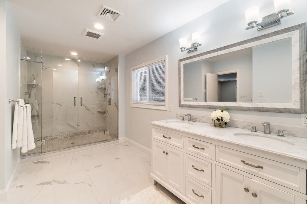 51 Donna Road Newton, MA 02459 - Photo 12 of 30 a bathroom with a granite countertop sink mirror and shower
