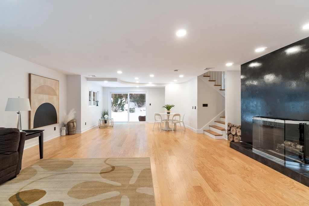 51 Donna Road Newton, MA 02459 - Photo 21 of 30 a living room with furniture a table and kitchen view