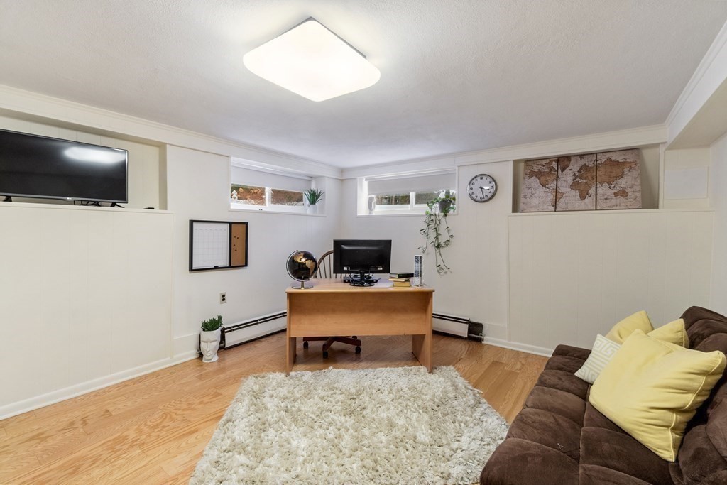 51 Donna Road Newton, MA 02459 - Photo 22 of 30 a living room with furniture and a flat screen tv