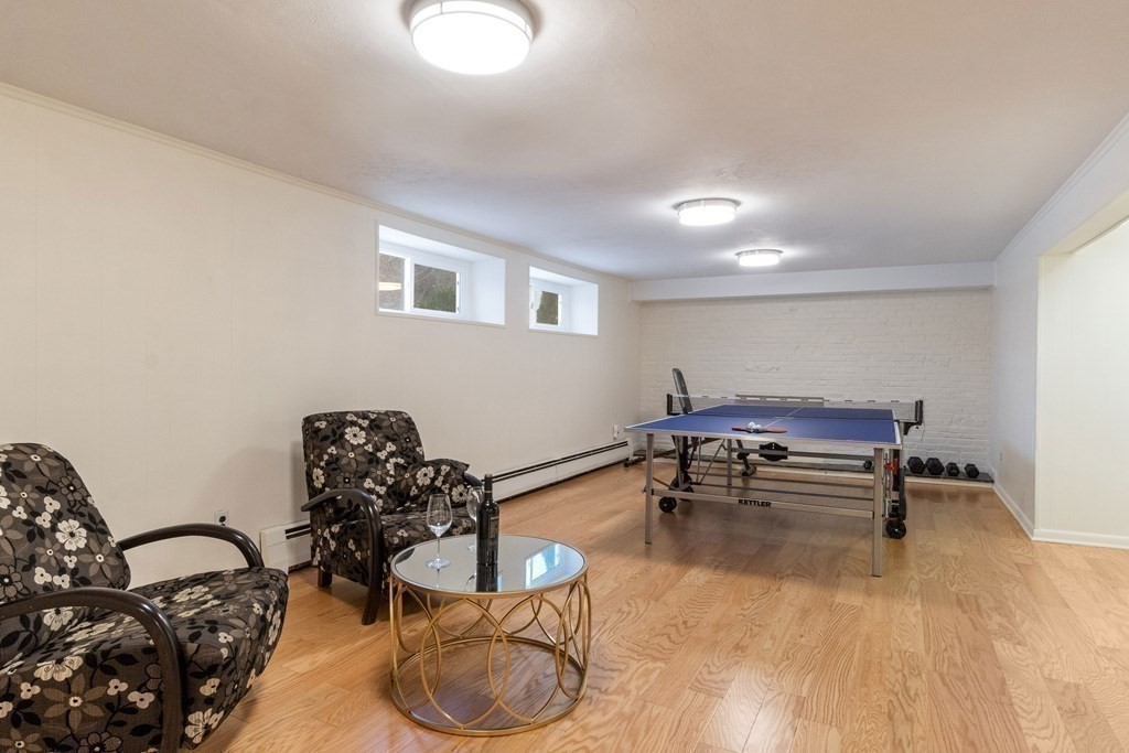 51 Donna Road Newton, MA 02459 - Photo 23 of 30 a living room with furniture and a wooden floor