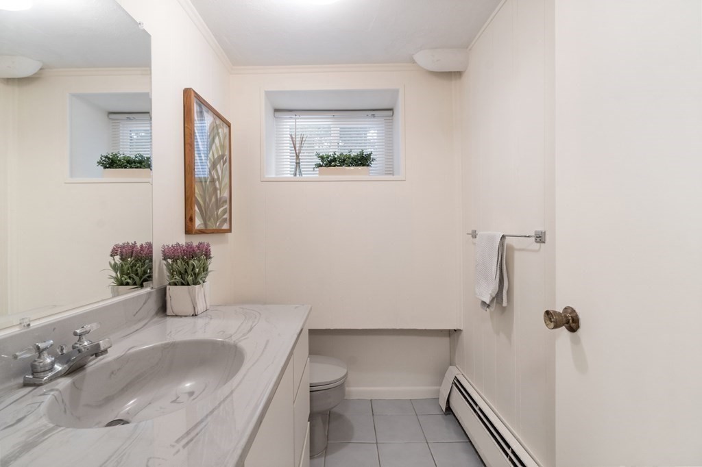 51 Donna Road Newton, MA 02459 - Photo 25 of 30 a bathroom with a sink toilet and shower