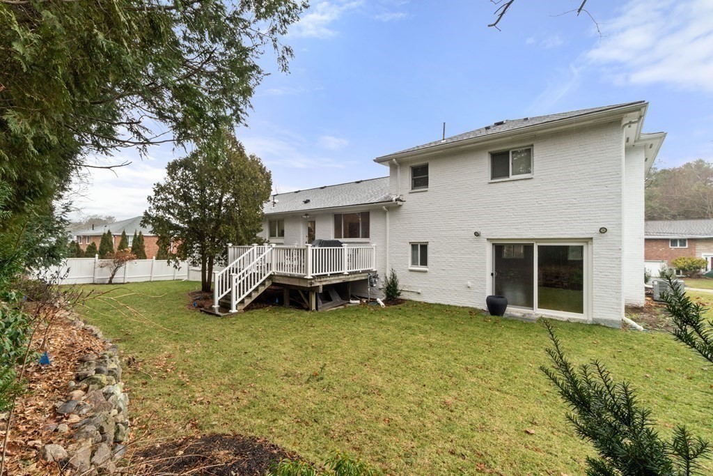 51 Donna Road Newton, MA 02459 - Photo 29 of 30 a view of a house with a yard and a garage