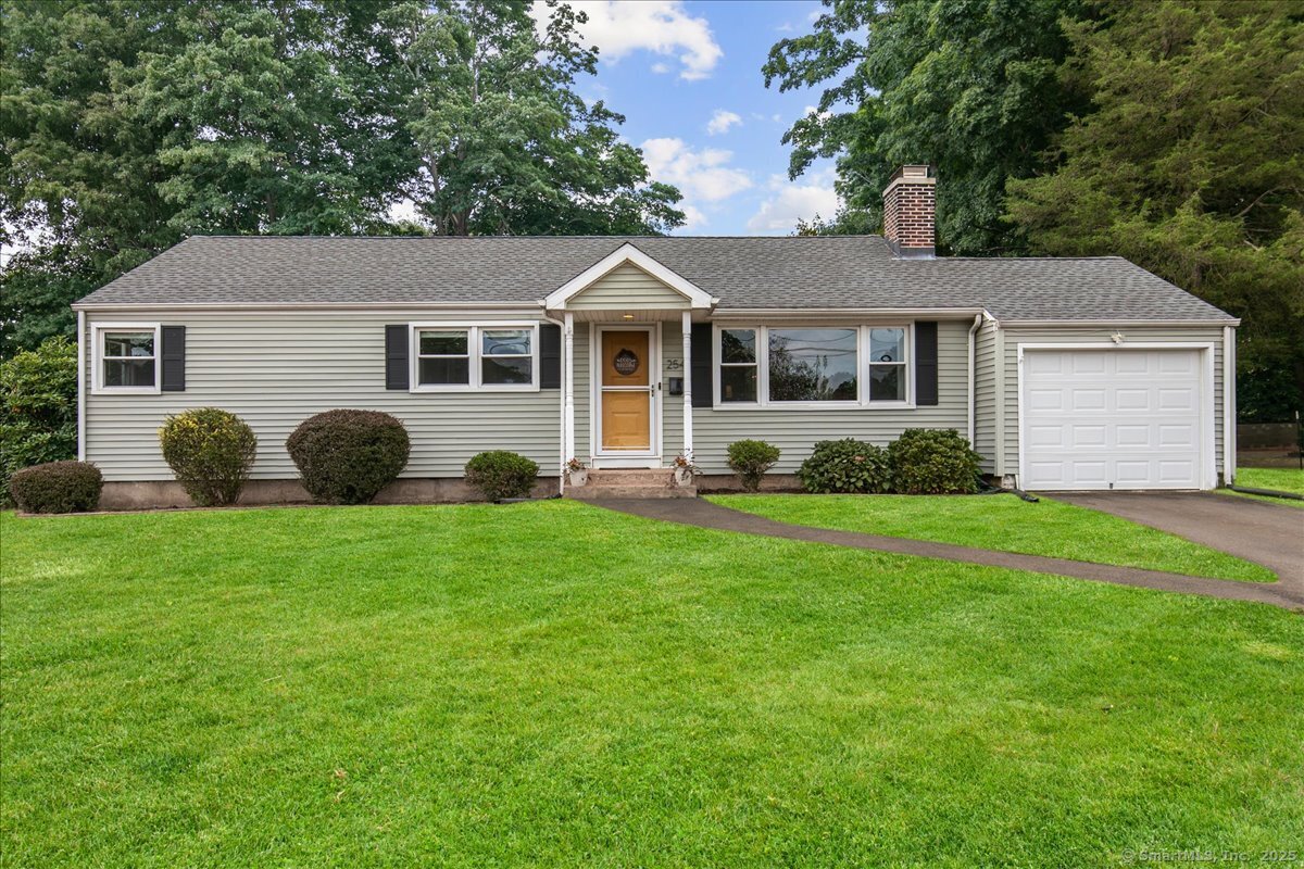 254 Riverside Drive Hamden, CT 06518 - Photo 1 of 1 a front view of a house with a garden
