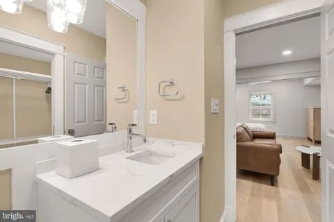 a en suite bathroom with a sink and a mirror