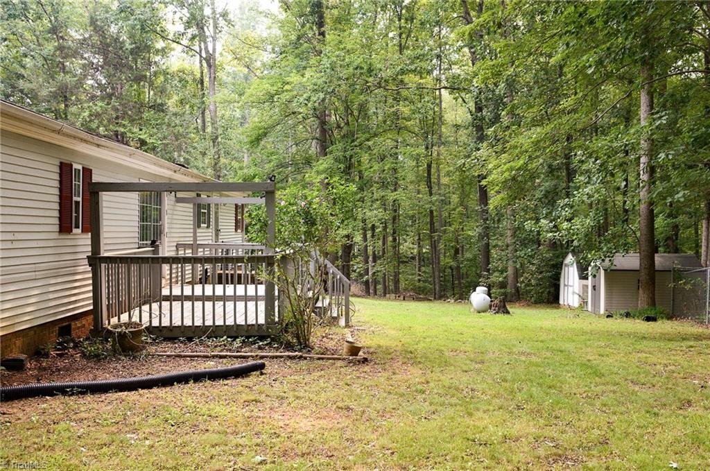 2103 Millcroft Road Pleasant Garden, NC 27313 - Photo 24 of 27 Enjoy relaxing or entertaining in this private and quiet backyard facing the woods! Propane tank is more than half full, so enjoy instant energy savings when you turn your heat on later this year!