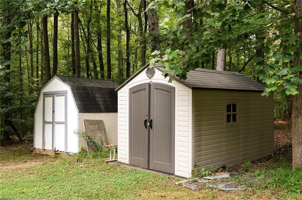 2103 Millcroft Road Pleasant Garden, NC 27313 - Photo 25 of 27 2 storage sheds in backyard stay with home