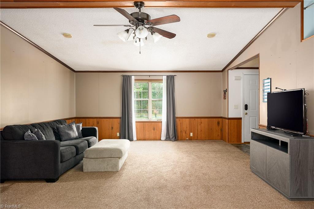 2103 Millcroft Road Pleasant Garden, NC 27313 - Photo 3 of 27 Spacious living room is 400+ square feet with vaulted ceiling
