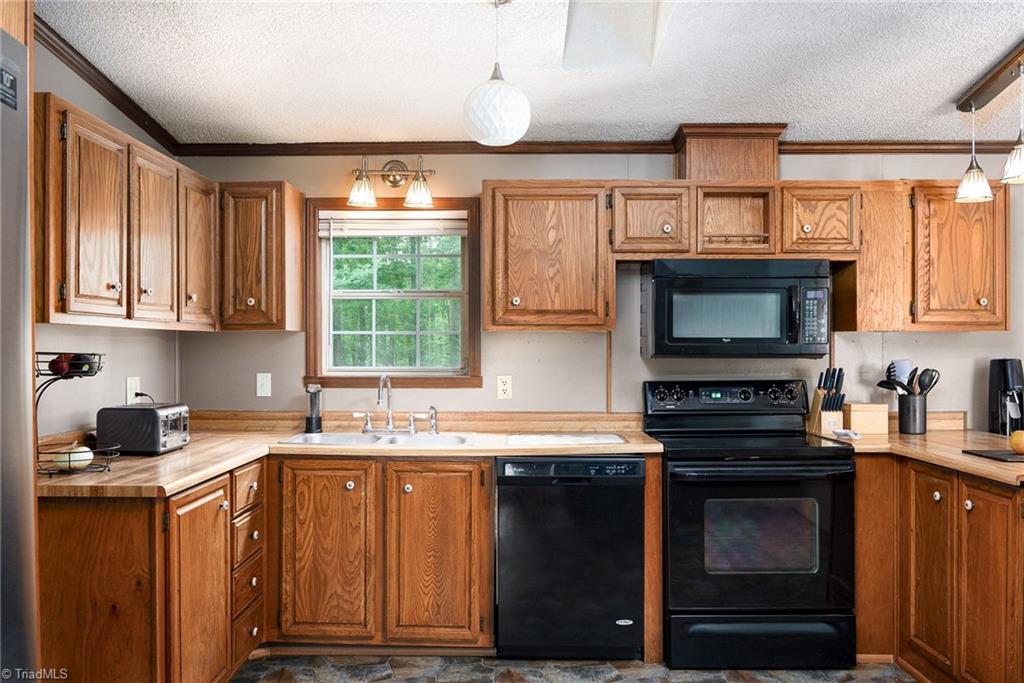 2103 Millcroft Road Pleasant Garden, NC 27313 - Photo 8 of 27 Kitchen offers lots of cabinets for storage