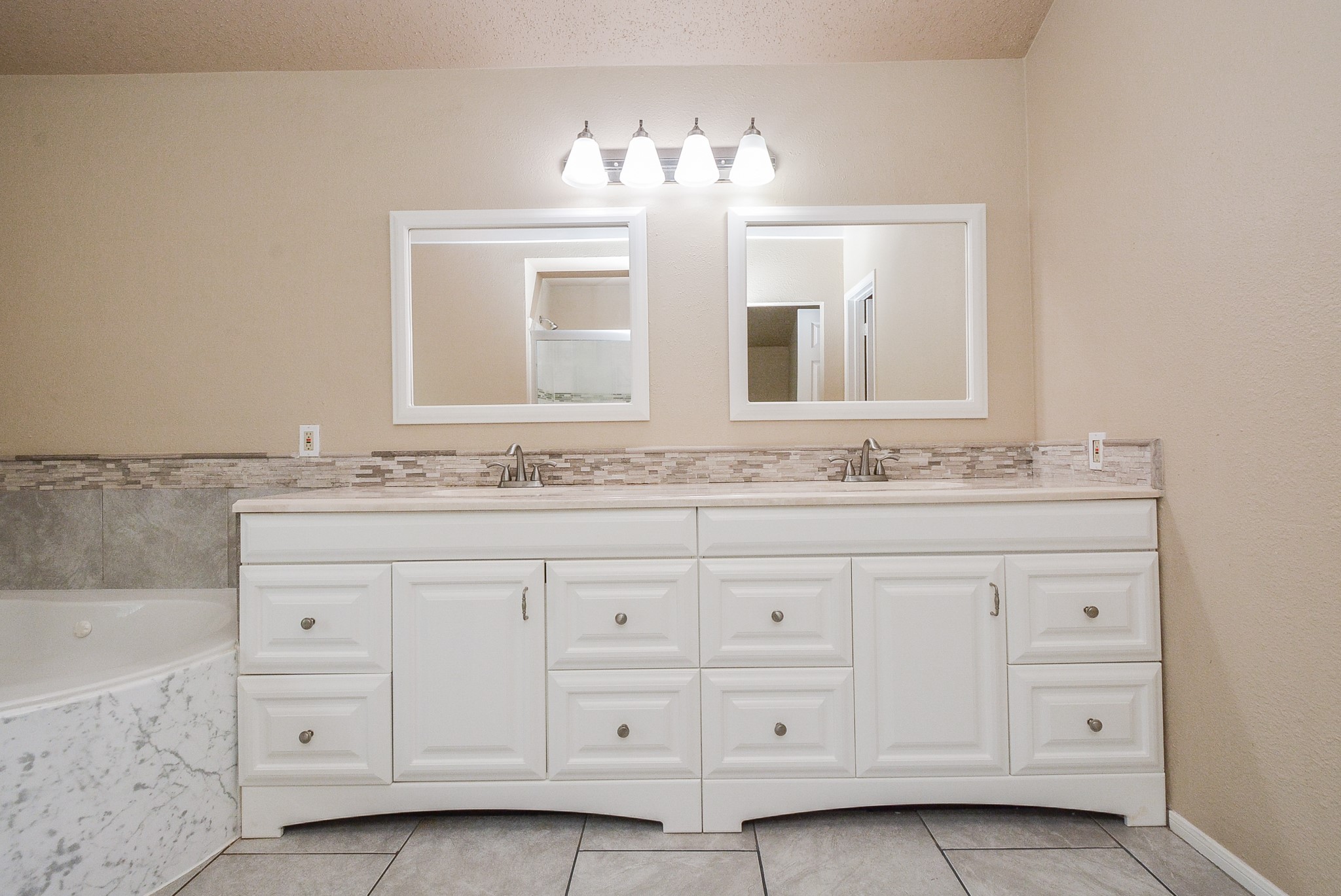 10 Ridgecross Place Spring, TX 77381 - Photo 20 of 32 a bathroom with a sink and a mirror