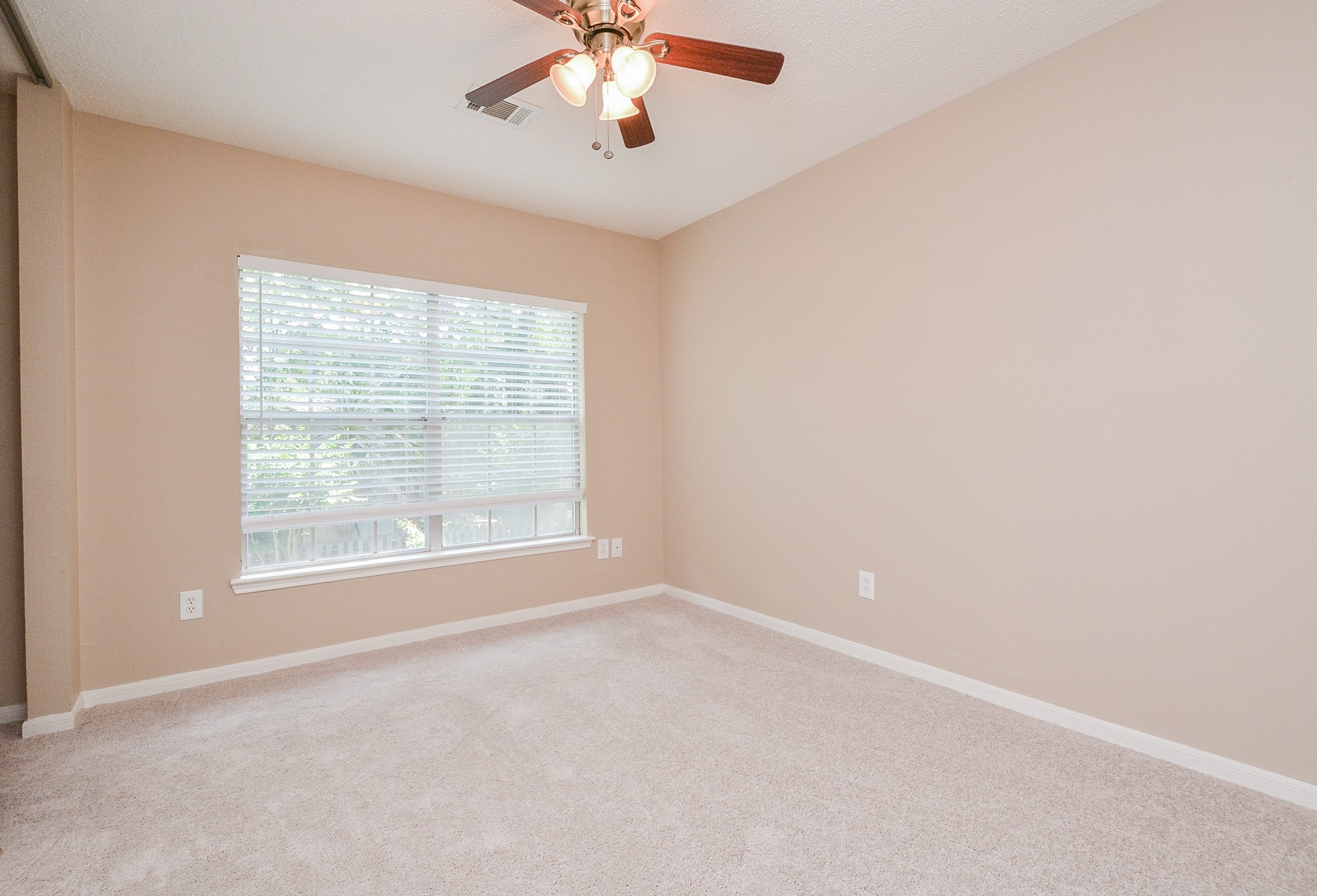 10 Ridgecross Place Spring, TX 77381 - Photo 24 of 32 an empty room with a window