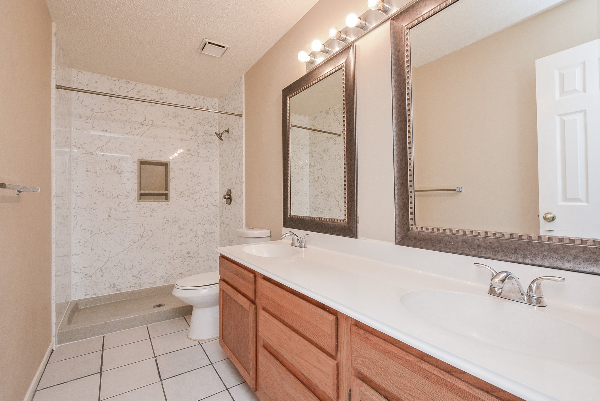10 Ridgecross Place Spring, TX 77381 - Photo 28 of 32 a bathroom with a sink a toilet and mirror