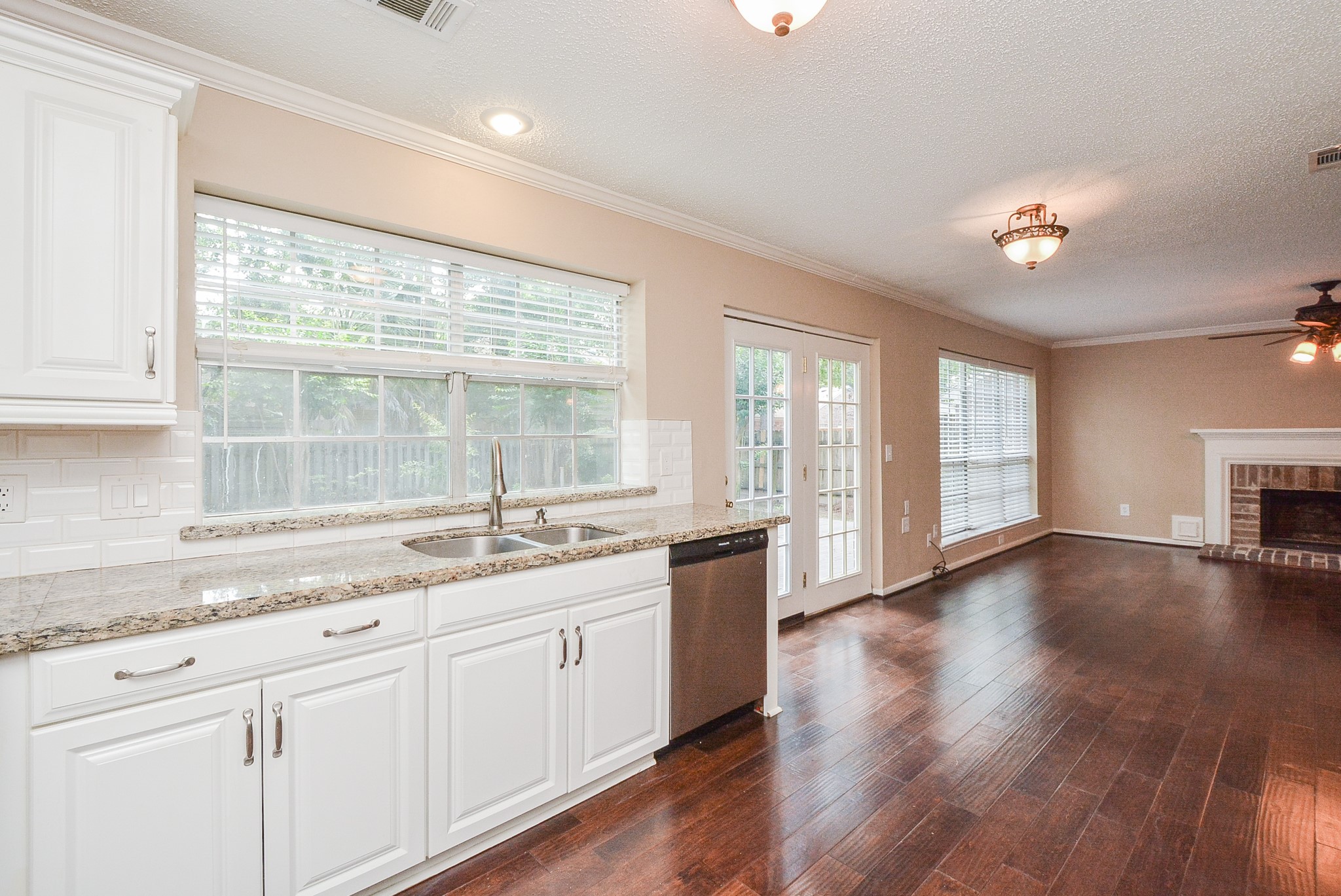 10 Ridgecross Place Spring, TX 77381 - Photo 9 of 32 a kitchen with a sink and large window