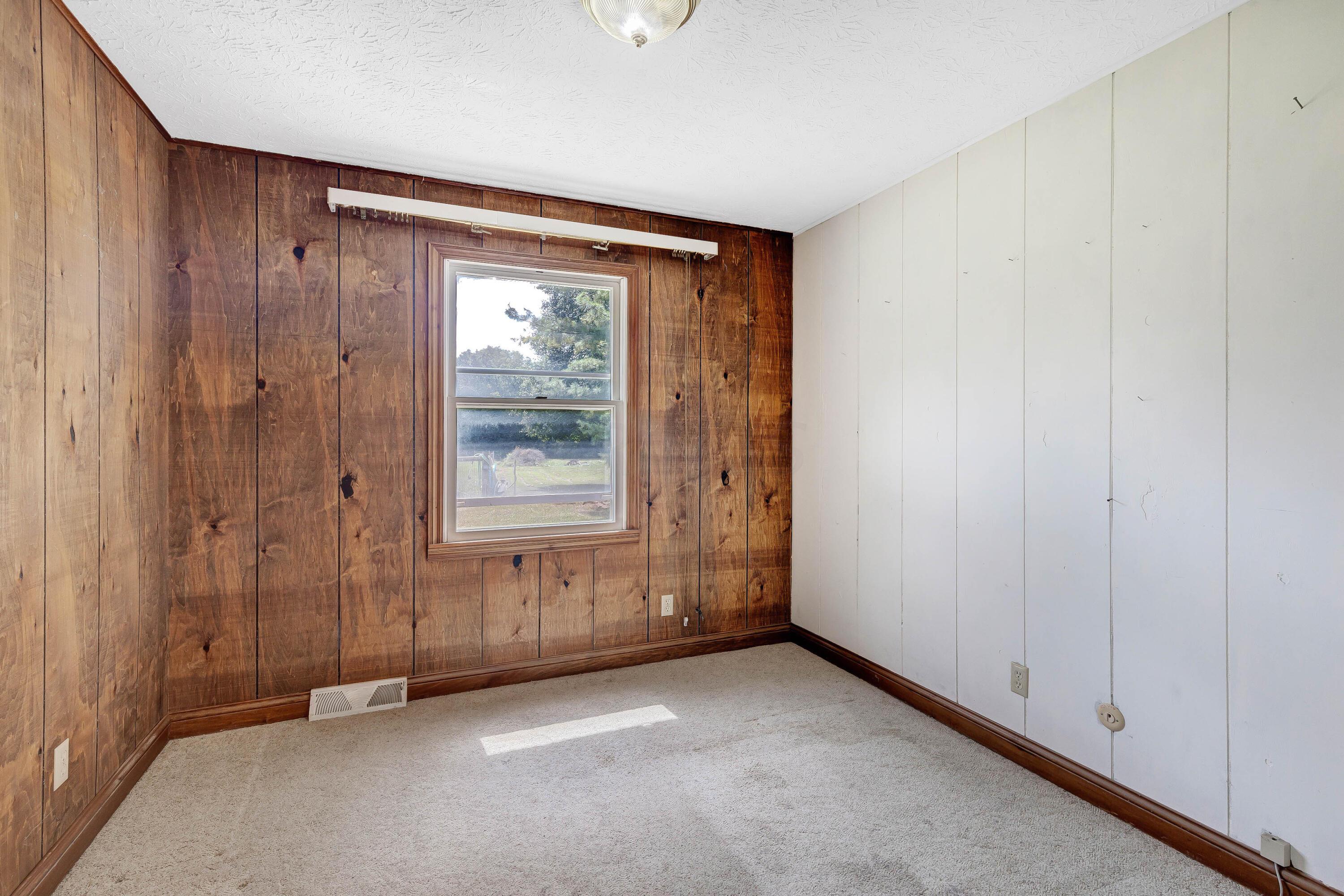 8558 Morris Road Hilliard, OH 43026 - Photo 14 of 74 • Tan carpet • Panelled walls • Ceiling light • Open closet