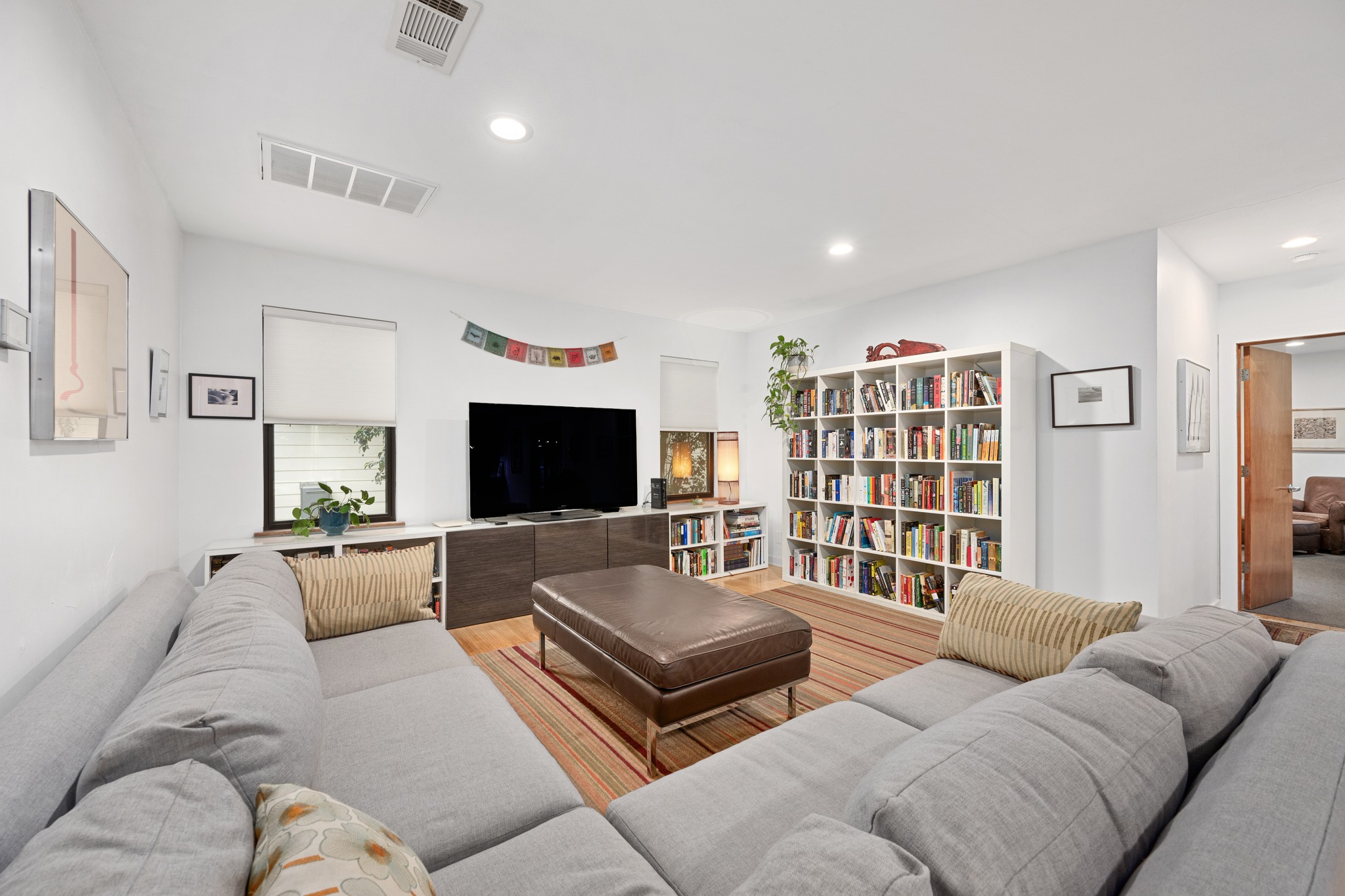 2111 Wright Street Austin, TX 78704 - Photo 2 of 30 a living room with furniture and a flat screen tv