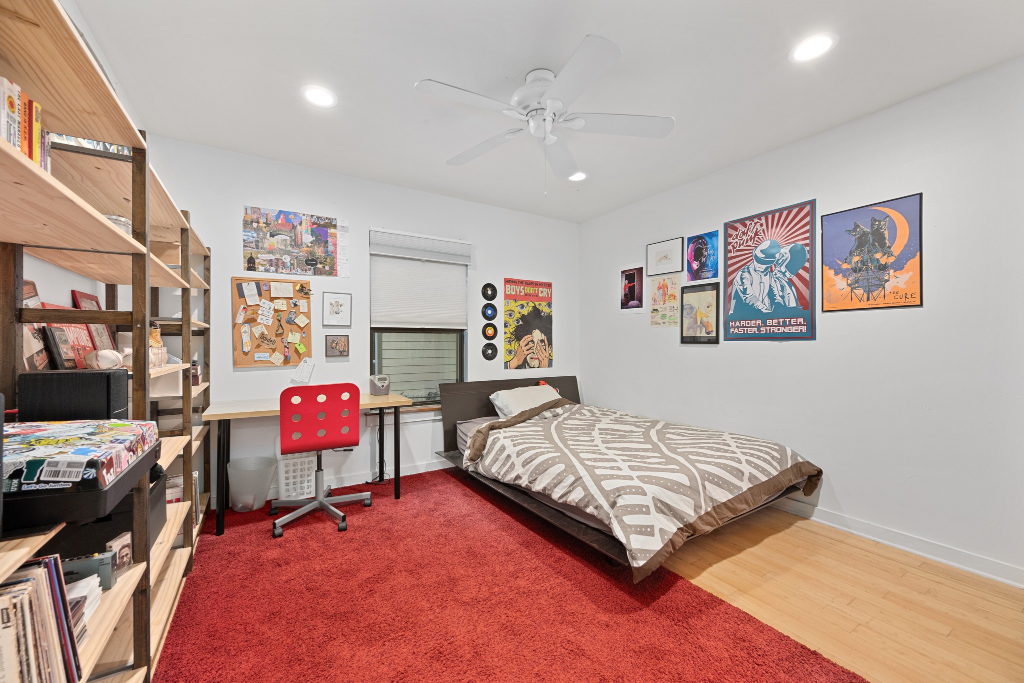 2111 Wright Street Austin, TX 78704 - Photo 23 of 30 a bedroom with a bed and a bookshelf