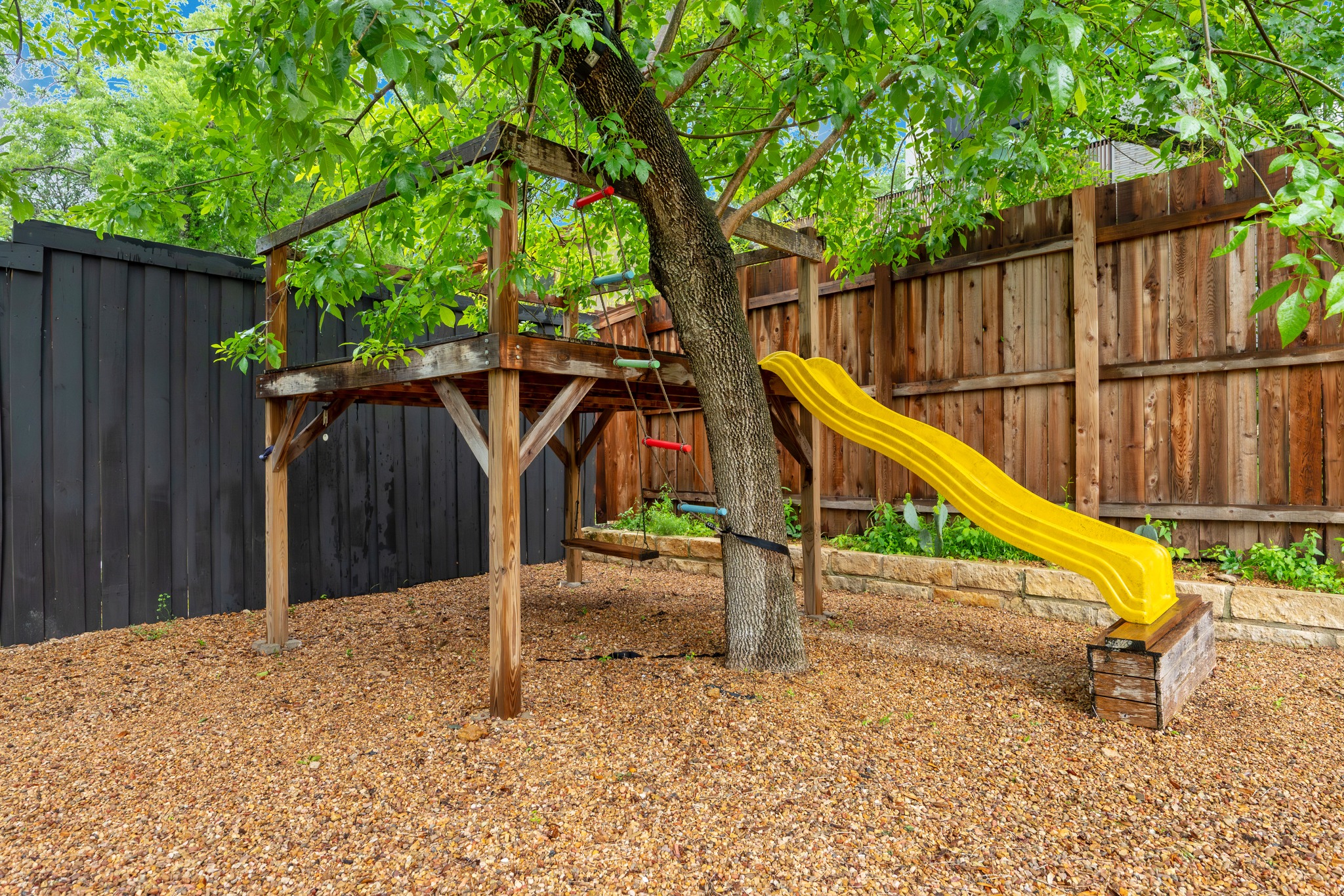 2111 Wright Street Austin, TX 78704 - Photo 28 of 30 a view of wooden deck with chairs and wooden fence