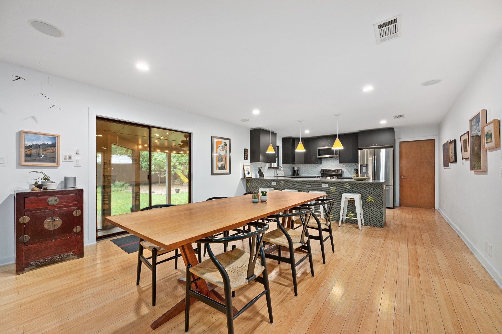 2111 Wright Street Austin, TX 78704 - Photo 3 of 30 a view of a dining room with furniture and wooden floor
