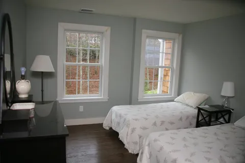 a bedroom with bed and window