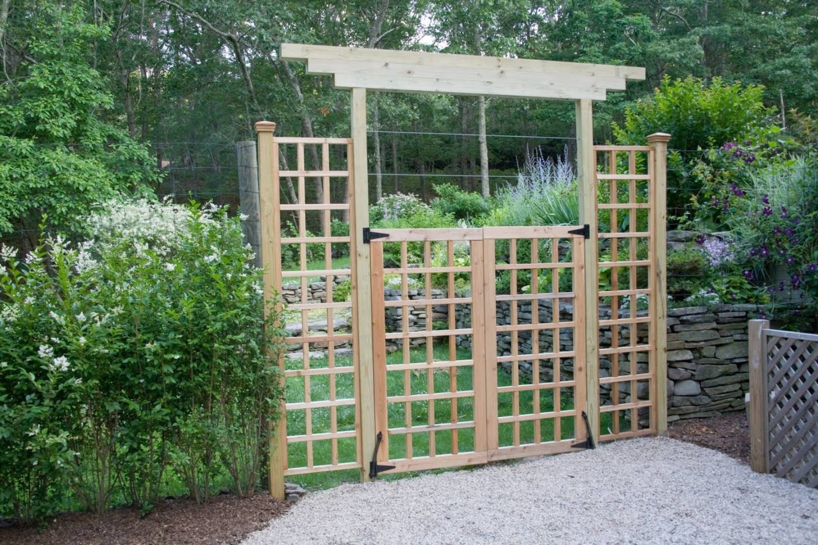 7 Bridge Hill Lane Bridgehampton, NY 11963 - Photo 15 of 16 a front view of a house with a garden