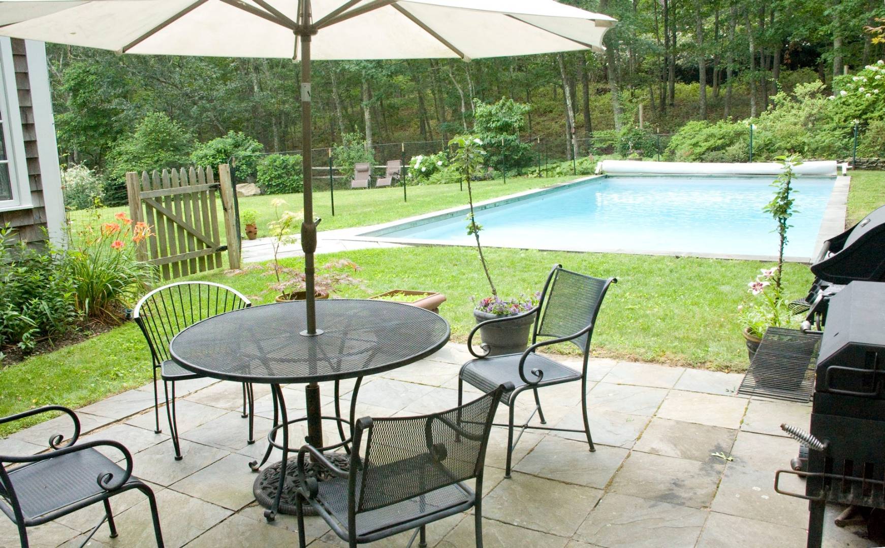 7 Bridge Hill Lane Bridgehampton, NY 11963 - Photo 2 of 16 a view of a chairs and table in the patio