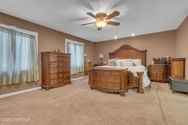 a bedroom with furniture and a chandelier