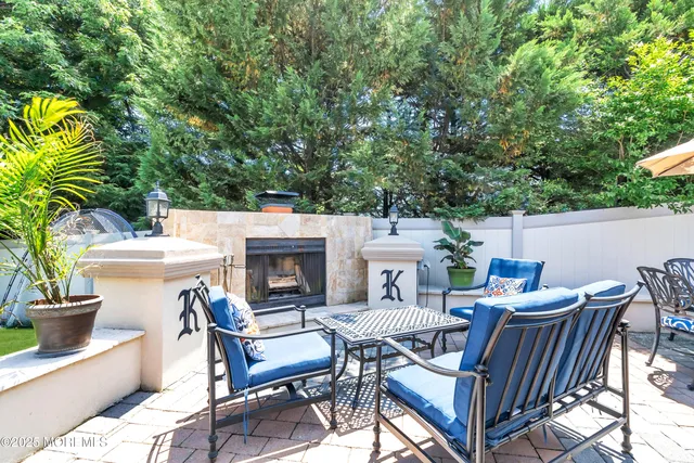 a view of a patio with a table and chairs