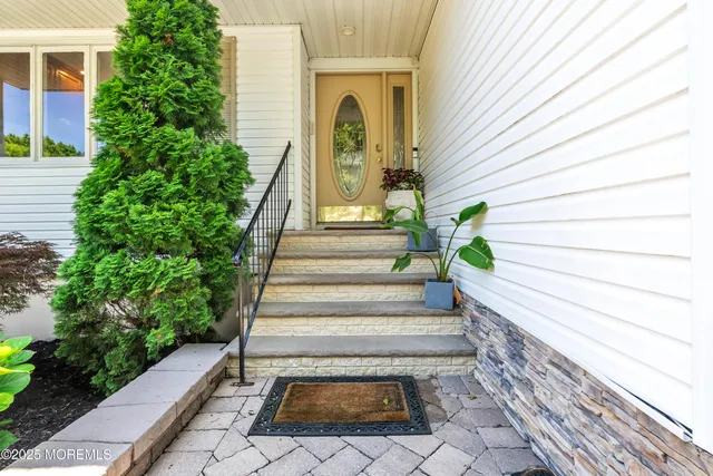 a view of entryway with flower pots