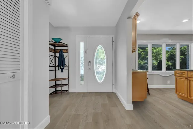 an entryway with a door and a window