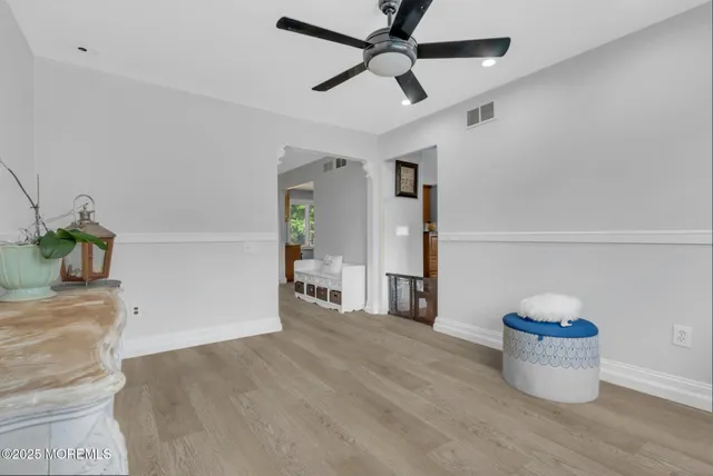 a view of empty room and wooden floor