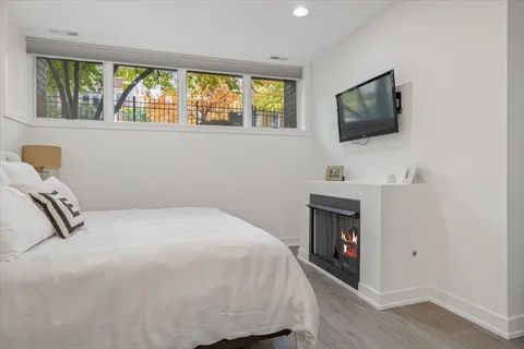 a spacious bathroom with a tub sink shower and mirror