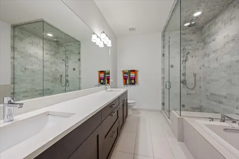 a bathroom with a shower and a bathtub