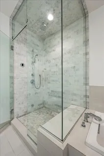 a bedroom with furniture and a wooden floor