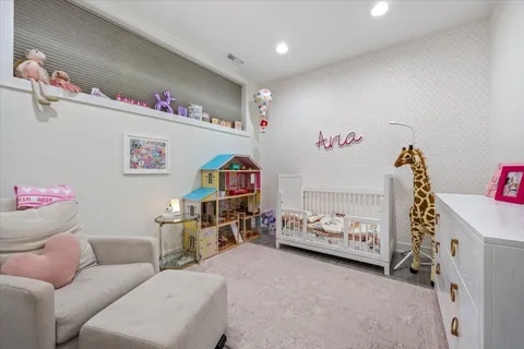 a bathroom with a sink mirror vanity and toilet