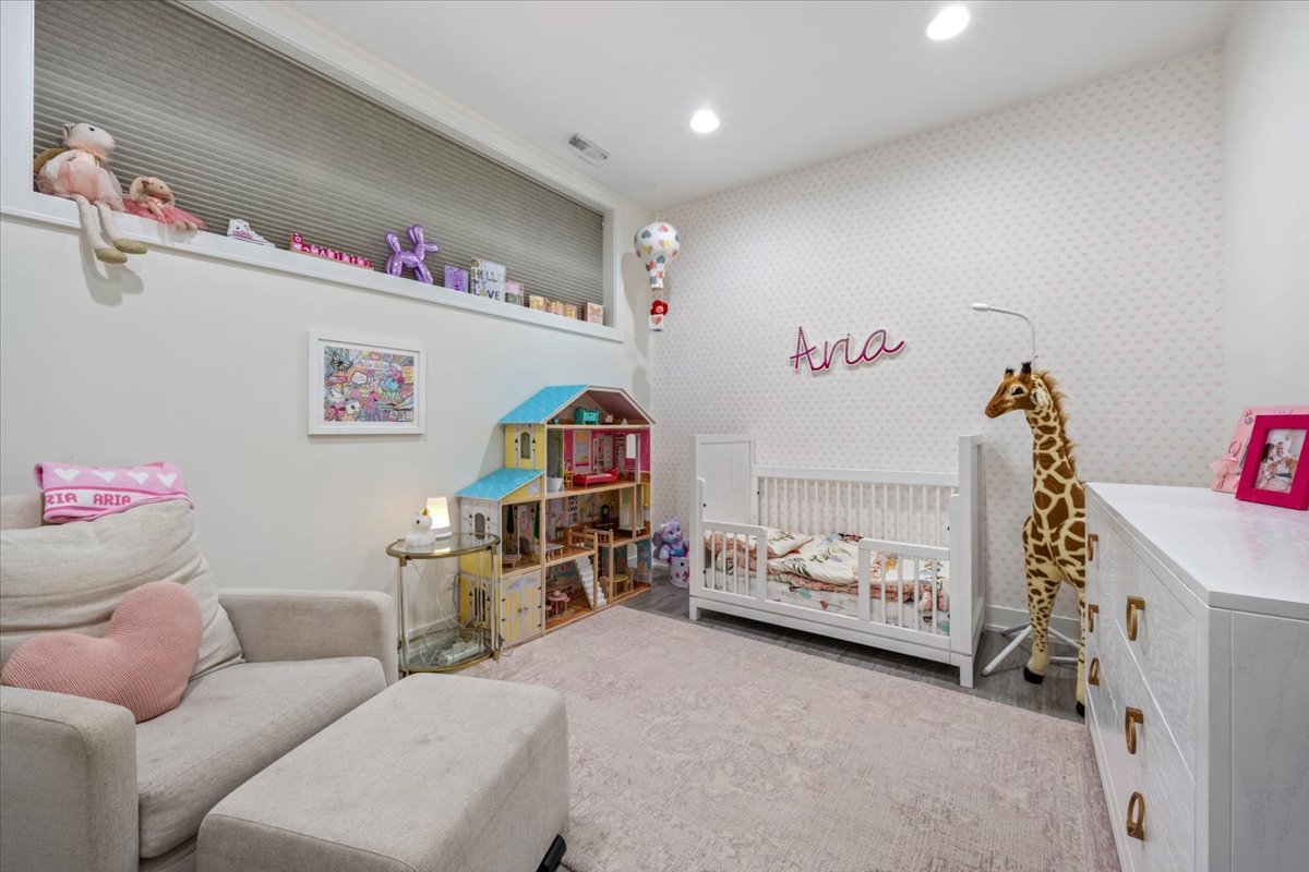 951 North Winchester Avenue, Unit 1 Chicago, IL 60622 - Photo 19 of 28 a bedroom with furniture and a wooden floor