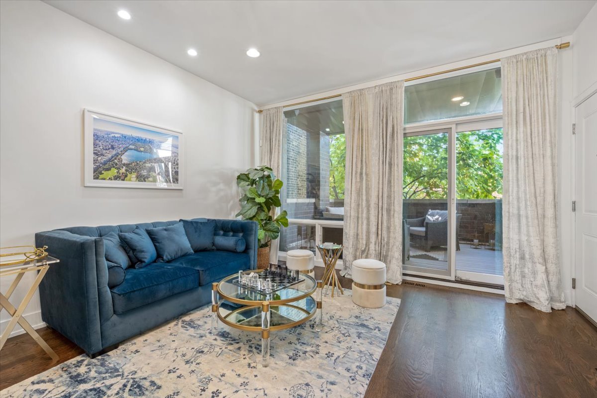 951 North Winchester Avenue, Unit 1 Chicago, IL 60622 - Photo 5 of 28 a living room with furniture and a large window