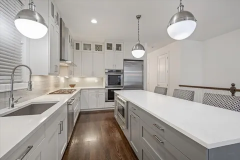 a living room with furniture fireplace and window