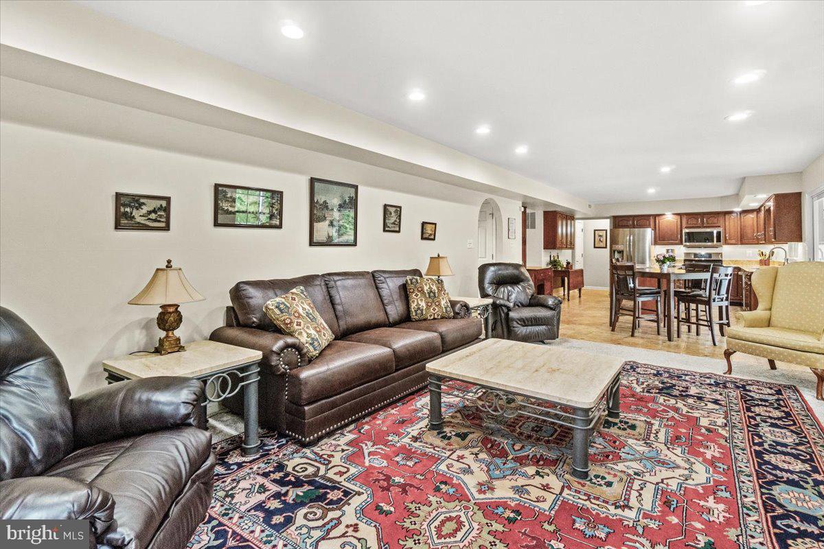 2218 West Greenleaf Drive Frederick, MD 21702 - Photo 19 of 46 a living room with furniture and view of kitchen